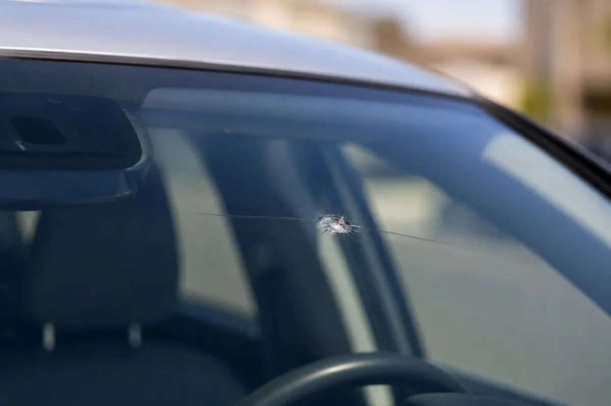 Technician repairing a windshield chip in Albuquerque